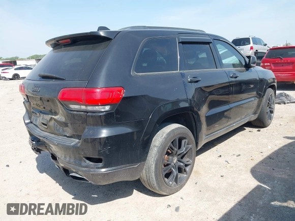 2015 Jeep Grand Cherokee Summit with VIN 1C4RJFJM1FC867861, listed as a IAAI auction lot 42034207 with 92,205 mi miles and . Bid and sale history available at DreamBid. Image 4.