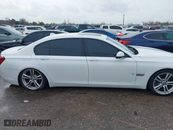 2015 BMW 7 Series 740Li with VIN WBAYE4C54FD947205, listed as a IAAI auction lot 41566291 with 172,729 mi miles and . Bid and sale history available at DreamBid. Image 13.