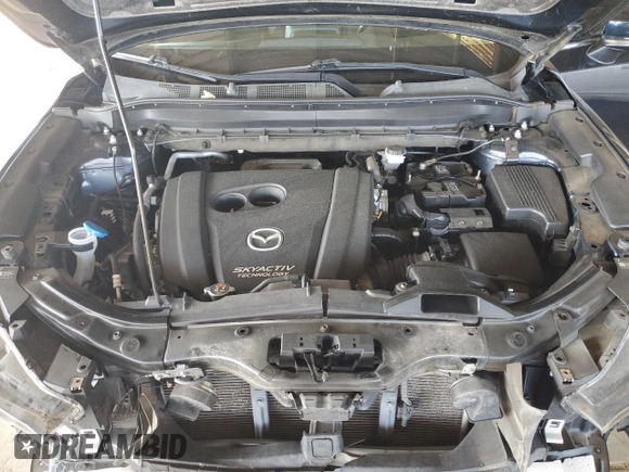 2019 Mazda CX-5 Grand Touring with VIN JM3KFADM3K1539890, listed as a Copart auction lot 57809835 with 56,079 mi miles and Salvage title. Bid and sale history available at DreamBid. Image 12.