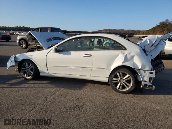 2006 Mercedes-Benz CLK-Class 3.5L with VIN WDBTJ56J76F171100, listed as a Copart auction lot 77068234 with 86,635 mi miles and Salvage Title. Bid and sale history available at carsss.com. Image 2.