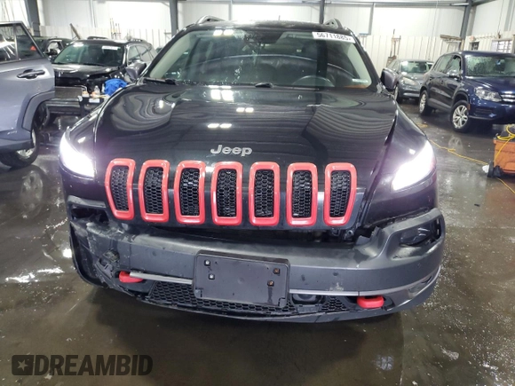 2014 Jeep Cherokee Trailhawk with VIN 1C4PJMBSXEW187981, listed as a Copart auction lot 56711885 with 157,317 mi miles and Salvage title. Bid and sale history available at DreamBid. Image 5.