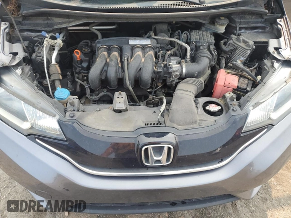 2015 Honda Fit EX-L z VIN 3HGGK5H83FM757658, wystawiony jako Copart lot #59907425 z przebiegiem 139 053 mil mil oraz Szkoda całkowita • Salvage title. Historia ofert i sprzedaży dostępna na DreamBid. Obrazek 11.