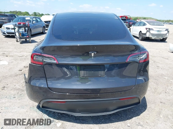 2024 Tesla Model Y with VIN 7SAYGDED3RF019063, listed as a IAAI auction lot 42061888 with 13,763 mi miles and . Bid and sale history available at DreamBid. Image 15.