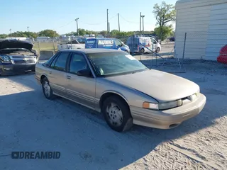 1997 Oldsmobile Cutlass Supreme S z VIN 1G3WH52MXVF314579, wystawiony jako IAAI lot #41755336 z przebiegiem 145 916 mil mil oraz . Historia ofert i sprzedaży dostępna na DreamBid. Obrazek 1.
