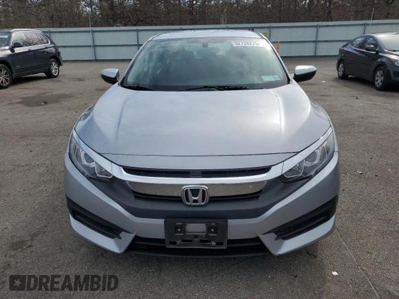 2017 Honda Civic LX z VIN 2HGFC2F52HH551152, wystawiony jako Copart lot #52728275 z przebiegiem 64 376 mil mil oraz Szkoda całkowita • Salvage title. Historia ofert i sprzedaży dostępna na DreamBid. Obrazek 5.