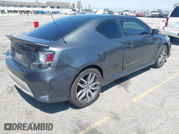 2015 Scion tC with VIN JTKJF5C74F3090309, listed as a IAAI auction lot 41988036 with 158,240 mi miles. Bid and sale history available at carsss.com. Image 4.