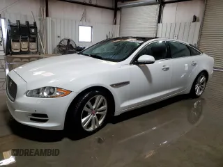 2014 Jaguar XJ Portfolio with VIN SAJWJ2GD1E8V63127, listed as a Copart auction lot 77994544 with 80,170 mi miles and Clean title. Bid and sale history available at DreamBid. Image 1.