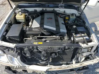 1999 Lexus LX 470 z VIN JT6HT00W1X0074382, wystawiony jako Copart lot #53612205 z przebiegiem 256 689 mil mil oraz Szkoda całkowita • Salvage title. Historia ofert i sprzedaży dostępna na DreamBid. Obrazek 12.