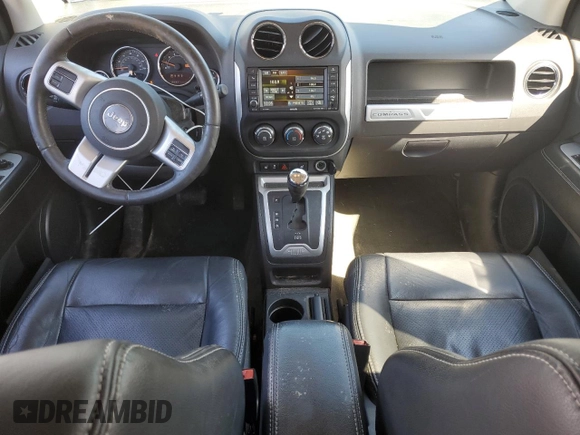 2016 Jeep Compass High Altitude Edition with VIN 1C4NJDEB0GD772702, listed as a Copart auction lot 52634105 with 74,494 mi miles and Salvage Title. Bid and sale history available at carsss.com. Image 8.