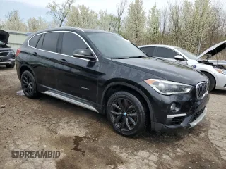 2017 BMW X1 xDrive28i with VIN WBXHT3C37H5F76075, listed as a Copart auction lot 53315395 with 143,141 mi miles and Clean title. Bid and sale history available at DreamBid. Image 4.