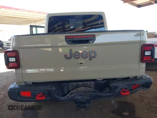 2022 Jeep Gladiator Rubicon with VIN 1C6JJTBG2NL164117, listed as a IAAI auction lot 42450350 with 22,326 mi miles and . Bid and sale history available at DreamBid. Image 6.