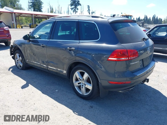 2012 Volkswagen Touareg Sport with VIN WVGFK9BP0CD004951, listed as a IAAI auction lot 42724125 with 173,993 mi miles and . Bid and sale history available at DreamBid. Image 3.