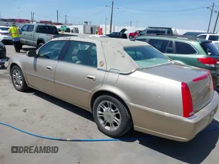 2006 Cadillac DTS w/1SC with VIN 1G6KD57Y26U112518, listed as a IAAI auction lot 42100747 with 122,149 mi miles. Bid and sale history available at carsss.com. Image 3.