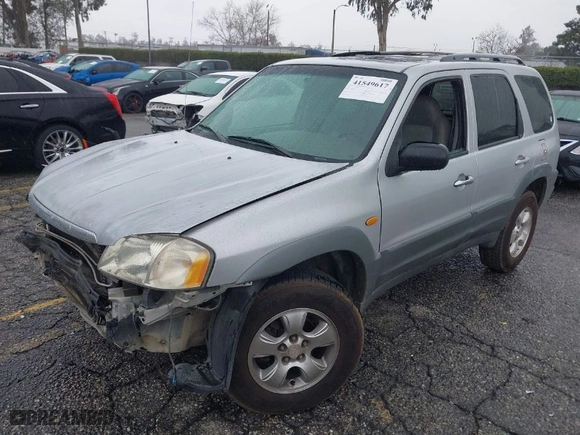 2001 Mazda Tribute LX with VIN 4F2YU09151KM22080, listed as a IAAI auction lot 41549617 with 164,975 mi miles. Bid and sale history available at carsss.com. Image 2.