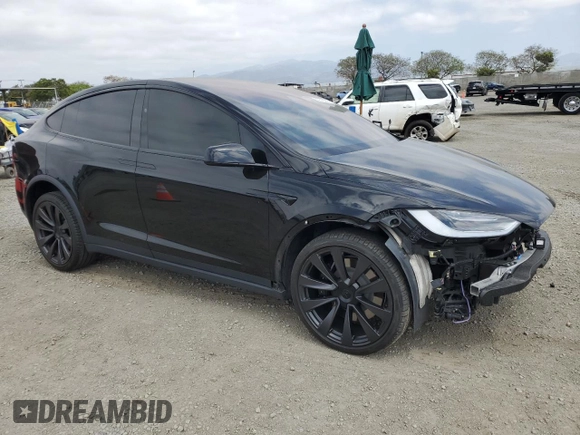 2022 Tesla Model X with VIN 7SAXCDE59NF360610, listed as a Copart auction lot 52575365 with 51,557 mi miles and Salvage Title. Bid and sale history available at carsss.com. Image 4.