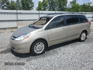 2010 Toyota Sienna XLE with VIN 5TDYK4CC8AS341185, listed as a Copart auction lot 61654325 with 220,313 mi miles and Salvage title. Bid and sale history available at DreamBid. Image 1.