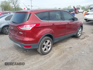 2014 Ford Escape SE with VIN 1FMCU0GX2EUB60526, listed as a IAAI auction lot 42060469 with 128,796 mi miles. Bid and sale history available at carsss.com. Image 4.