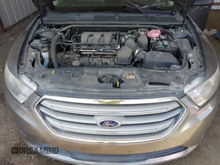 2014 Ford Taurus SE with VIN 1FAHP2D89EG136335, listed as a IAAI auction lot 41880655 with 211,635 mi miles. Bid and sale history available at carsss.com. Image 10.