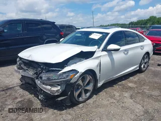 2019 Honda Accord Touring with VIN 1HGCV2F96KA015987, listed as a IAAI auction lot 42528744 with 174,735 mi miles and . Bid and sale history available at DreamBid. Image 22.