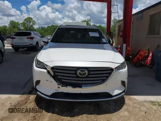 2016 Mazda CX-9 Grand Touring with VIN JM3TCADYXG0113563, listed as a IAAI auction lot 42593120 with 237,696 mi miles and . Bid and sale history available at DreamBid. Image 12.