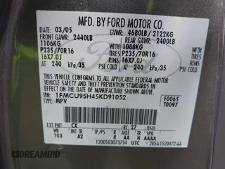 2005 Ford Escape Hybrid with VIN 1FMCU95H45KD91052, listed as a IAAI auction lot 42200393 with 304,817 mi miles and . Bid and sale history available at DreamBid. Image 9.