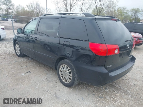 2009 Toyota Sienna XLE with VIN 5TDZK22C09S225520, listed as a IAAI auction lot 42126813 with 217,573 mi miles. Bid and sale history available at carsss.com. Image 3.