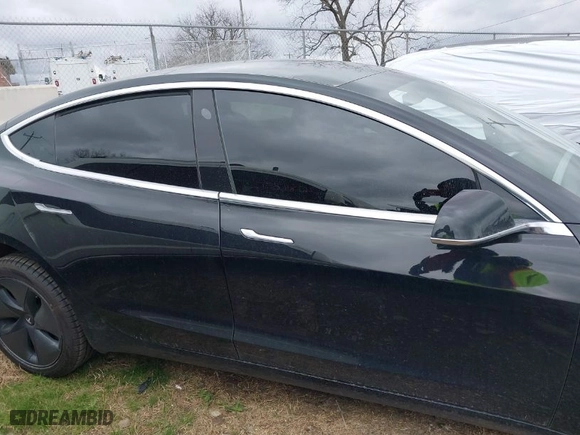 2019 Tesla Model 3 Mid Range with VIN 5YJ3E1EA2KF317028, listed as a IAAI auction lot 41781580 with 107,496 mi miles. Bid and sale history available at carsss.com. Image 13.