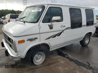 1995 Chevrolet Chevy Van z VIN 1GBEG25H0SF243534, wystawiony jako Copart lot #64175964 z przebiegiem 134 916 mil mil oraz Szkody całkowita. Historia ofert i sprzedaży dostępna na DreamBid. Obrazek 1.