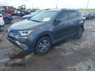 2016 Toyota RAV4 LE with VIN JTMZFREV5GJ097330, listed as a IAAI auction lot 41884397 with 107,699 mi miles. Bid and sale history available at carsss.com. Image 2.
