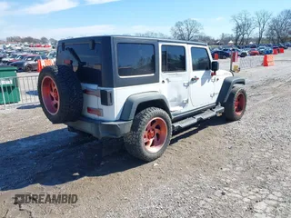 2016 Jeep Wrangler Unlimited Rubicon Hard Rock with VIN 1C4HJWFG9GL296782, listed as a IAAI auction lot 41595273 with 113,338 mi miles. Bid and sale history available at carsss.com. Image 4.