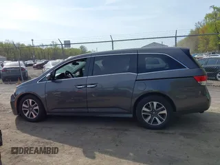 2014 Honda Odyssey Touring with VIN 5FNRL5H92EB073085, listed as a IAAI auction lot 42065913 with 120,834 mi miles and . Bid and sale history available at DreamBid. Image 14.