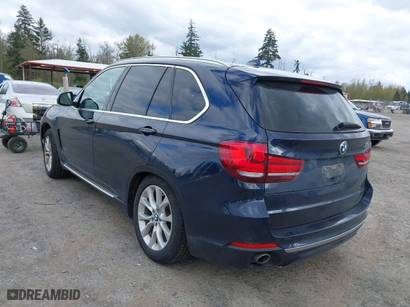 2015 BMW X5 xDrive35d with VIN 5UXKS4C55F0J98874, listed as a IAAI auction lot 42030583 with 151,079 mi miles. Bid and sale history available at carsss.com. Image 3.