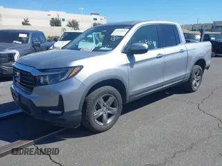 2022 Honda Ridgeline RTL-E with VIN 5FPYK3F78NB016045, listed as a IAAI auction lot 41626864 with 57,130 mi miles and . Bid and sale history available at DreamBid. Image 2.