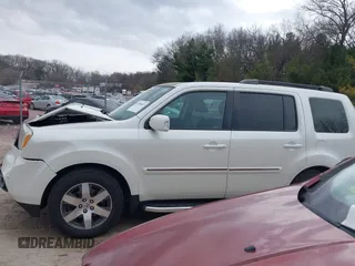 2014 Honda Pilot Touring with VIN 5FNYF4H91EB041614, listed as a IAAI auction lot 42050405 with 158,236 mi miles and . Bid and sale history available at DreamBid. Image 14.