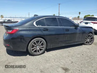2021 BMW 3 Series 330i with VIN 3MW5R1J08M8B86329, listed as a Copart auction lot 50404285 with 33,545 mi miles and Clean Title. Bid and sale history available at carsss.com. Image 3.