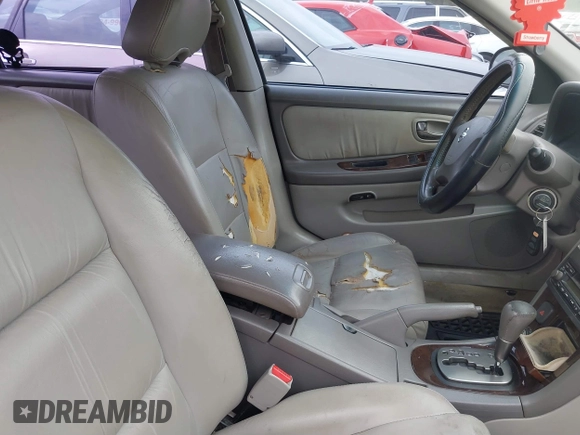 2002 Nissan Maxima GLE z VIN JN1DA31D42T411097, wystawiony jako IAAI lot #41667218 z przebiegiem 213 560 mil mil oraz . Historia ofert i sprzedaży dostępna na DreamBid. Obrazek 5.