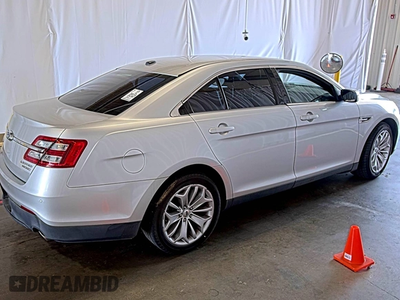 2014 Ford Taurus Limited with VIN 1FAHP2F82EG153927, listed as a IAAI auction lot 42200419 with 154,867 mi miles. Bid and sale history available at carsss.com. Image 1.