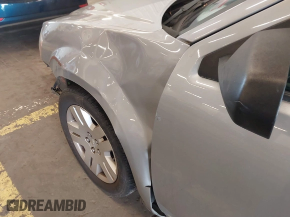 2014 Dodge Avenger SE with VIN 1C3CDZAB4EN161536, listed as a IAAI auction lot 41604009 with 107,957 mi miles. Bid and sale history available at carsss.com. Image 13.