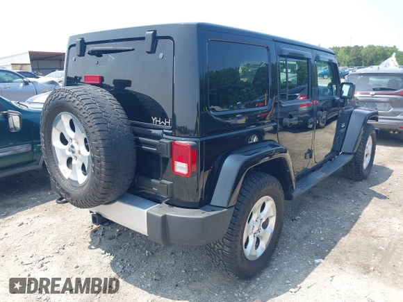 2014 Jeep Wrangler Unlimited Sahara with VIN 1C4BJWEG0EL273086, listed as a IAAI auction lot 42340938 with 121,448 mi miles and . Bid and sale history available at DreamBid. Image 4.