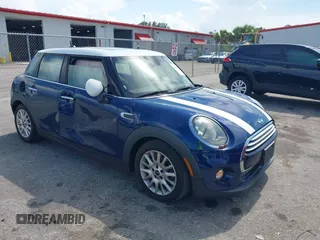 2015 MINI Hardtop 4 Door with VIN WMWXS5C51FT827510, listed as a IAAI auction lot 42365599 with 53,667 mi miles and . Bid and sale history available at DreamBid. Image 1.