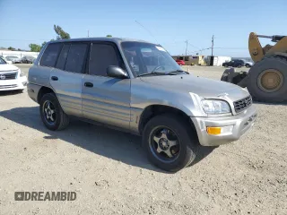 2000 Toyota RAV4 with VIN JT3GP10V2Y0052306, listed as a Copart auction lot 54726325 with 244,910 mi miles and Salvage title. Bid and sale history available at DreamBid. Image 4.