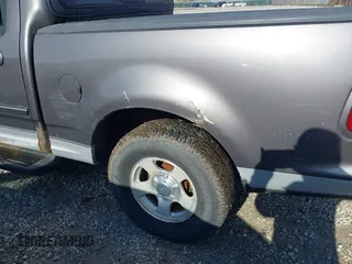 2003 Ford F-150 XLT with VIN 1FTRW07L13KB66977, listed as a IAAI auction lot 41967541 with 124,714 mi miles. Bid and sale history available at carsss.com. Image 6.