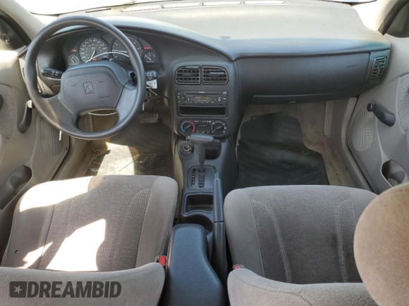 2001 Saturn SL z VIN 1G8ZK547X1Z294553, wystawiony jako Copart lot #53786805 z przebiegiem 288 011 mil mil oraz Szkody całkowita. Historia ofert i sprzedaży dostępna na DreamBid. Obrazek 8.