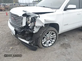 2018 GMC Yukon SLT with VIN 1GKS1BKC3JR279163, listed as a IAAI auction lot 40973940 with 122,445 mi miles. Bid and sale history available at carsss.com. Image 6.