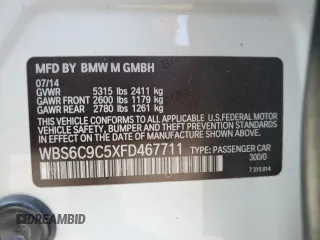 2015 BMW M6 z VIN WBS6C9C5XFD467711, wystawiony jako Copart lot #66574644 z przebiegiem 101 001 mil mil oraz Szkody całkowita. Historia ofert i sprzedaży dostępna na DreamBid. Obrazek 14.