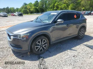 2018 Mazda CX-5 Grand Touring with VIN JM3KFADM9J0343621, listed as a Copart auction lot 52284475 with 129,776 mi miles and Salvage Title. Bid and sale history available at DreamBid. Image 1.