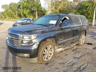 2018 Chevrolet Tahoe LT with VIN 1GNSCBKC1JR365875, listed as a IAAI auction lot 41584072 with 61,957 mi miles. Bid and sale history available at carsss.com. Image 2.