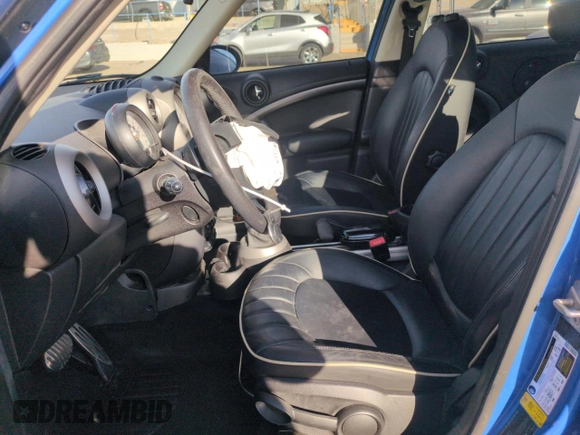 2012 MINI Countryman S with VIN WMWZC3C57CWL80976, listed as a Copart auction lot 50023105 with 74,504 mi miles and Salvage Title. Bid and sale history available at DreamBid. Image 7.