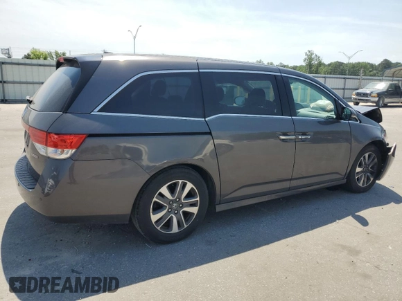 2014 Honda Odyssey Touring with VIN 5FNRL5H93EB061754, listed as a Copart auction lot 55182015 with 168,058 mi miles and Salvage title. Bid and sale history available at DreamBid. Image 3.