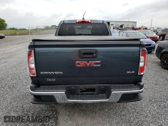 2015 GMC Canyon 2WD SLE with VIN 1GTH5BEA7F1158758, listed as a Copart auction lot 63617524 with 102,744 mi miles and Salvage Title. Bid and sale history available at carsss.com. Image 6.